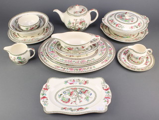 A Ye Olde Indian Tree pattern tea and dinner service comprising 3 tea cups, 3 saucers, a teapot, milk jug, cream jug and sugar bowl, 6 tea plates, 6 small plates, 5 medium plates, 5 dinner plates, 7 dessert bowls, a salad bowl, 2 tureens and covers, 4 oval serving plates, 2 sauce boats and stands, 2 serving plates