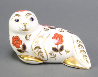 A Royal Crown Derby Japan pattern paperweight in the form of a seal with gold stopper 5 1/2" 