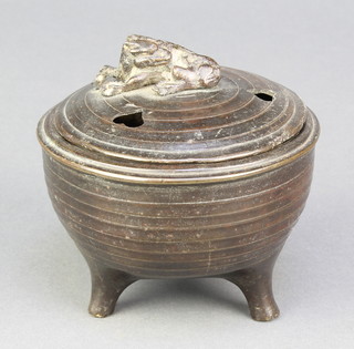A Chinese bronze archaistic style censer and cover, the finial in the form of a reclining Shi Shi  with pierced heart shaped lid 3 3/4" 