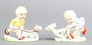 A pair of Wade Mabel Lucy Attwell figures of children walking dogs 2 1/2" 