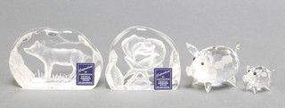 A Swarovski figure of a pig 1 3/4", a smaller ditto 1", boxed, 2 Dartington Crystal paperweights boxed 