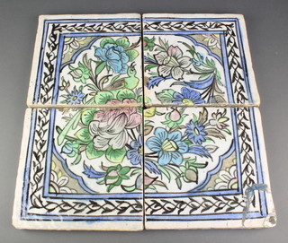 Four early 20th Century painted Persian tiles, the former border enclosing a bird amongst flowers 17 1/4" x 17 1/4" 