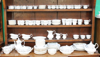 A Royal Albert Brigadoon pattern tea, coffee and dinner service comprising 10 small coffee cups, 11 small saucers, 10 medium tea cups, 11 medium saucers, 9 baluster coffee cups, 9 saucers, 4 mugs, 1 single mug, 1 large tea cup, 11 two handled bowls, 3 cream jugs, 2 sugar bowls, 1 slop bowl, teapot, coffee pot, milk jug, 2 small milk jugs, 23 tea plates, 10 small plates, 19 medium plates, 10 dinner plates, 2 oval serving plates, 2 tureens and covers, sandwich plate, salad bowl, 2 sauce boats, a sauce boat stand, 6 dessert bowls, 9 soup bowls, 2 oval dishes 