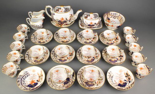 A 19th Century Spode Japan pattern tea and coffee set no.2214 comprising 10 coffee cups, 10 tea cups, 12 saucers, 2 cream jugs, a sucrier, lid and stand, a slop bowl and a large dish, a teapot and lid 
