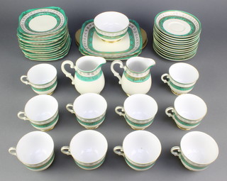 A Japanese porcelain tea set comprising 10 tea cups, 12 saucers, 2 milk jugs, sugar bowl, 2 sandwich plates, 12 tea plates
