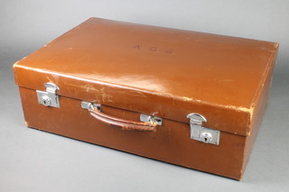 Hardy Bros. a brown leather vanity case, the interior fitted 8 bottles and a manicure set, (bottles missing) with chrome mounts and complete with canvas outer case 7 1/2"h x 23"w x 15 1/2"d 