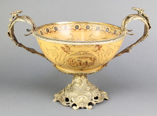 A gilt metal and porcelain mounted twin handled bowl, raised on a spreading foot 9" x 17" 