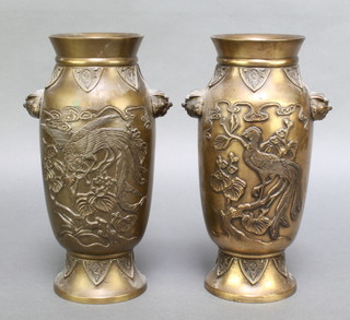 A pair of Japanese polished bronze twin handled vases decorated birds amongst branches 9 1/2" 