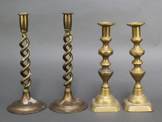A pair of 19th Century brass candlesticks with knopped stems 10", 1 repaired, and a pair of brass spiral turned candlesticks 12" 
