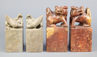 A pair of rectangular Chinese carved soapstone seals decorated pigeons 6" x 2 1/2" x 2 1/2" and one other pair decorated Dogs of Fo 7" x 3" x 2" 