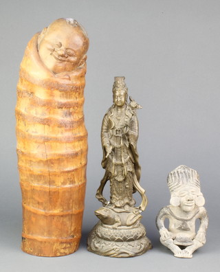 An Inca style terracotta figure 7", a Chinese bronze figure of a standing Deity 13" and a carved Chinese bamboo figure 17" 
