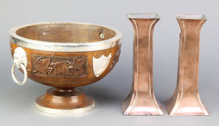 A pair of Newlyn style square waisted copper vases 8" together with a 1930's circular carved oak fruit bowl with silver plated mount and lion mask drop handles  6" x 9 1/2" (missing liner) 