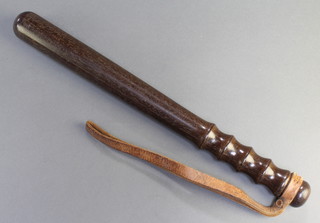 A Metropolitan Police turned wooden truncheon, stamped M a crown and P 14" 