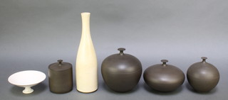 A collection of Studio Ceramics by Alan Spencer Green (1932-2003) comprising 3 lidded spherical boxes and covers, a cylindrical ditto, pedestal bowl and a baluster ewer 