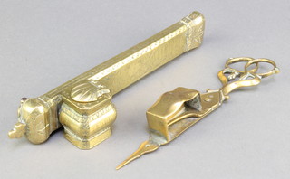 A 19th Century Persian brass scribes set, comprising rectangular pen case and incorporating an inkwell 7 1/2" together with a pair of 19th Century brass candle snuffers with old solder repair to the base