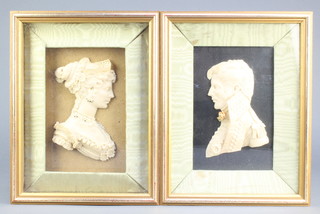 A pair of wax portrait wall plaques of a lady and gentleman 5" x 4", the reverse marked original by Leslie Ray  