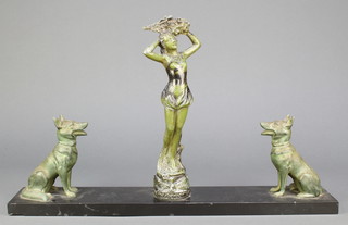An Art Deco and marble figure group in the form of a standing lady supported by 2 seated Alsatians 11" x 19"w x 3 1/2" 