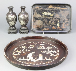 A pair of Chinese lacquered vases decorated dragons 6", ditto tray decorated figures 7" x 10" and a circular inlaid hardwood and mother of pearl tray 13" 