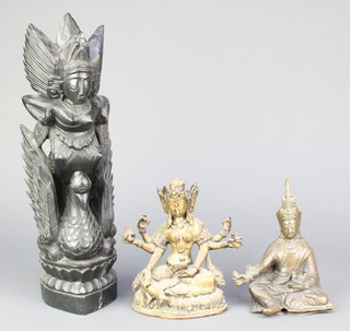 A bronze figure of a seated Buddha 8", a bronze figure of a Deity and a carved hardwood figure 15" 