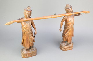 A pair of Burmese carved wooden figures of standing gentleman with arms outstretched, formerly a gong stand 14" 