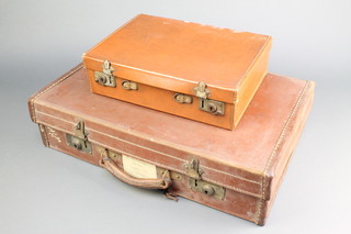 A 1930's leather suitcase with brass mounts 6" x 22" x 14 1/2", some scuffs to the leather, together with a small leather attache case  4" x 14" x 10"
