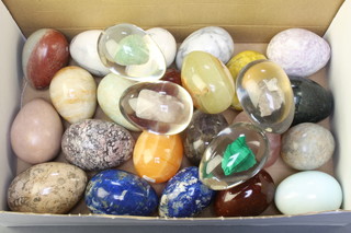 Twenty two various carved marble models of eggs and 4 perspex ditto