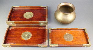 A circular Indian spitoon 7" and 3 Chinese graduated hardwood and metal banded trays 13" x 8 1/2", 12" x 7", 10" x 6" 