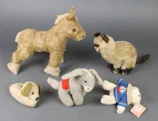 A felt figure of a standing horse 11"h, a figure of a seated cat 9", a figure of a donkey 7", figure of a seated dog 3" and a Steiff style figure of a seated tiger with green glass eyes 15", some wear to body and whiskers are missing 