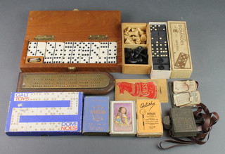 A TP Bus Company toy bus conductors ticket machine and tickets, a Staunton chess set, a set of Imperial dominoes, a Galt dominoes, 2 cribbage boards, a Belisha card game, a Waddingtons Lexicon card game and a set of playing cards (51 in total)  