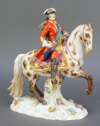 A Meissen figure of an 18th Century gentleman on horseback on a raised base with applied flowers, underglaze marks 1796.130A 11" 