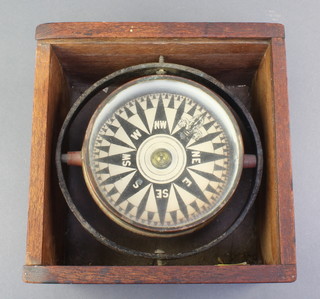 A ships compass with gimble contained in a mahogany case 
