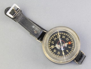 A Luftwaffe AK39 wrist compass, the back marked Armbandkompass, Baumuster AK39., Werk Nr:10157449 Antorderz F1 232335 
