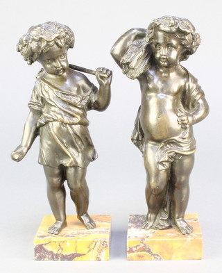 A pair of 19th Century bronze figures of harvesting cherubs raised on square marble bases 8" 