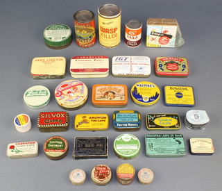 A tin of C.W.S. custard powder, a Beechams Pills packet, a Sulphur ointment tin and other tins