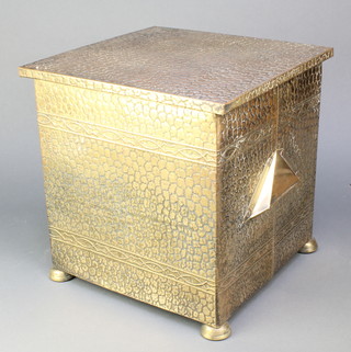 An Art Nouveau planished brass coal box with hinged lid, raised on bun feet 13"h x 13" x 12"  