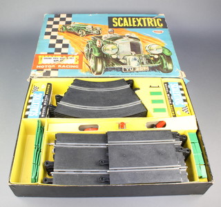 A Triang Scalextric Grand Prix racing set GP33 boxed containing a Lotus RE car, 1 other racing car and a hand controller 