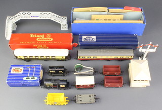 A Hornby OO gauge signal arm and 1 other signal, a Hornby platform and kiosk, a Triang R22 first class Pullman car and a small collection of rolling stock 