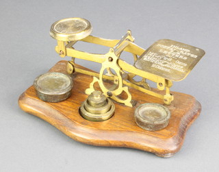 An oak and brass letter scales and weights 