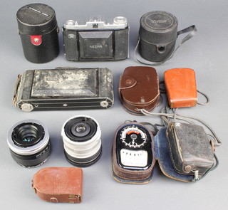 A Zeiss Ikon Nettar folding camera, a Kodak folding camera, a pair of light meters etc 