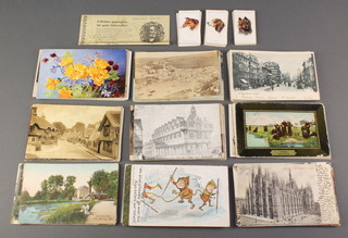 A collection of coloured and other postcards and a small collection of cigarette cards