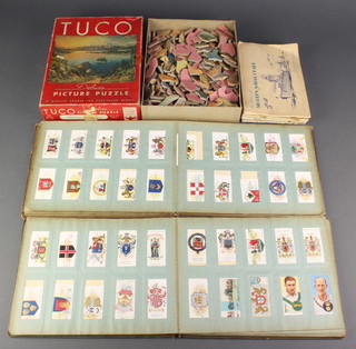 Four albums of Wills cigarette cards, 2 albums of Players cigarette cards and a Tuco jigsaw puzzle

