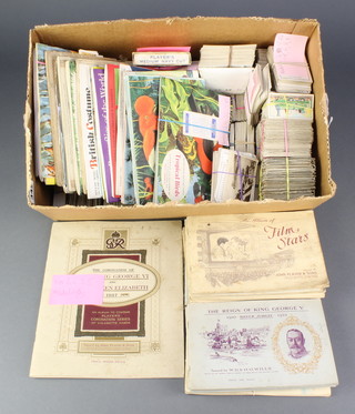 A collection of cigarette card albums, loose cigarette cards and tea cards 