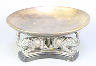 A circular bronze bowl supported by elephants  5 1/2" x 13 1/2" diam 