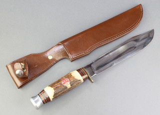A William Rodgers bowie knife with 8 1/2" blade, stag horn grip and leather sheath 