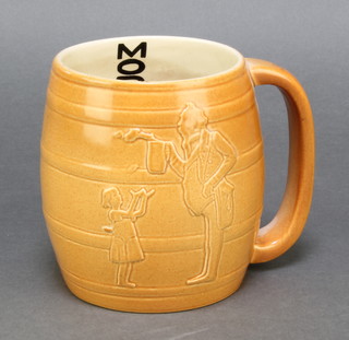 Ashtead Pottery, a tan glazed pottery mug, the interior inscribed Moderation 4 1/2" 