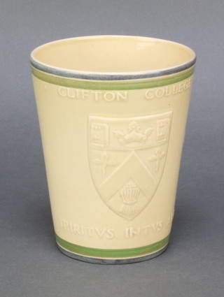 Ashtead Pottery, a tan glazed beaker decorated  the Arms of Clifton College 5" 