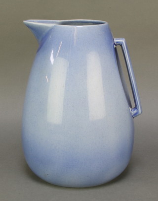 Ashtead Pottery, a blue glazed pottery jug with angular handle 11" 