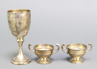 A silver trophy, Birmingham 1910, a pair of twin handled silver trophies Birmingham 1910, 147 grams