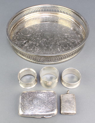 A Victorian silver vesta Birmingham 1876, 3 napkin rings, a cigarette case and a plated tray, 178 grams