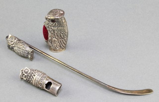 A modern repousse silver pin cushion in the form of an owl, a ditto pin and a whistle 
